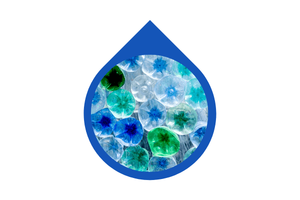 A droplet shaped photograph of plastic bottles ready to be recycled.